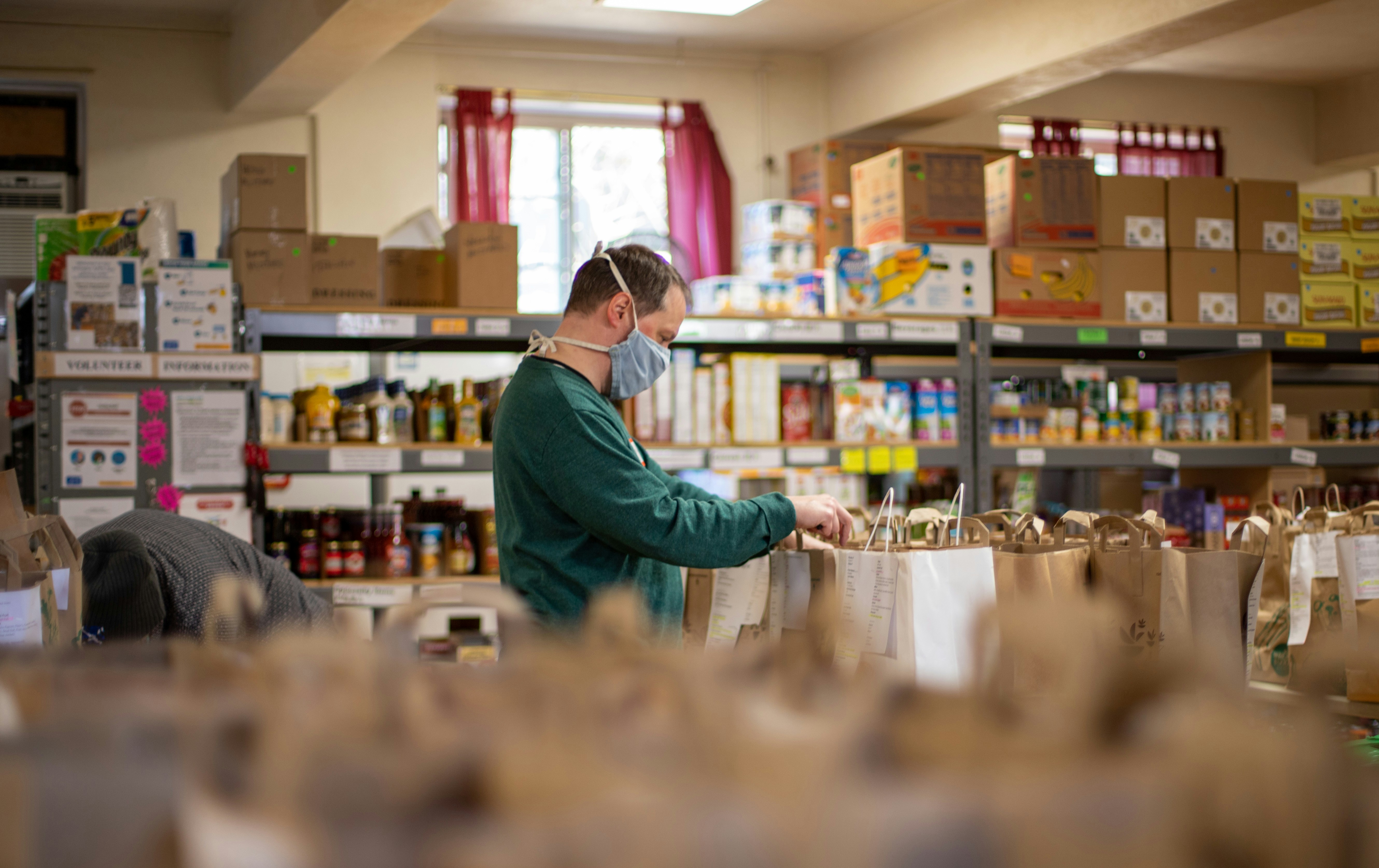 man sorting through donations